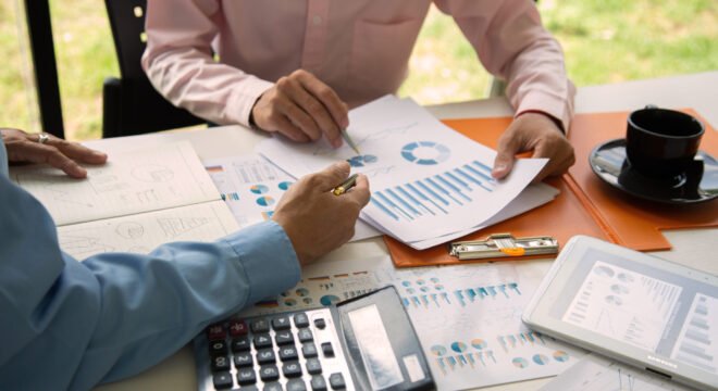 Businessmen are discussing and planning a long-term investment with tax law.power project concept